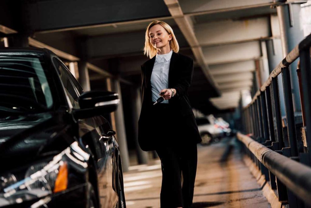 cheerful attractive blonde woman walking near blac 2024 11 12 23 06 54 utc