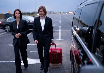 business couple walking with a suitcase on parking 2025 03 13 23 03 13 utc 11zon (1)