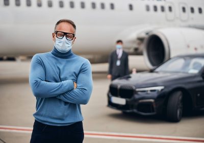passenger in a face mask and eyeglasses staring ah 2025 03 09 18 51 40 utc